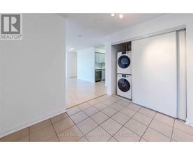 A room with a washing machine and dryer in it.