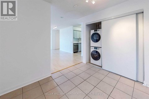 A room with a washing machine and dryer in it.