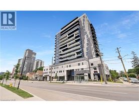 A tall building with a glass facade is the focal point of the image.