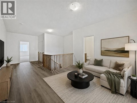 A well-lit, modern living room with a white sofa and a coffee table.