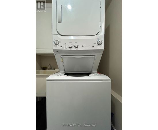 A white dishwasher is in a kitchen.