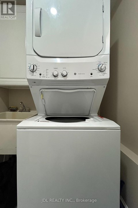 A white dishwasher is in a kitchen.