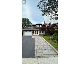 A house with a driveway in front of it.