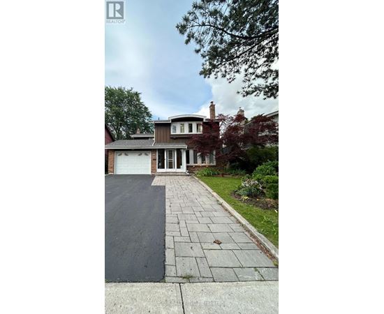 A house with a driveway in front of it.