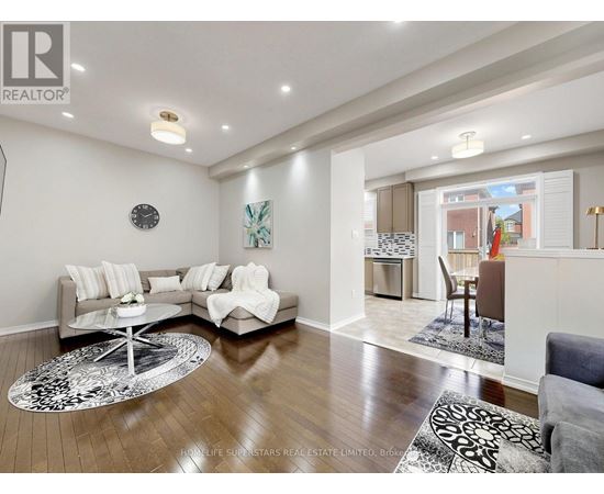 A living room with a grey sofa and a coffee table.