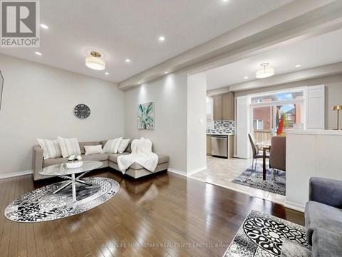 A living room with a grey sofa and a coffee table.