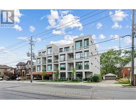 A modern apartment building with a clear sky in the background.