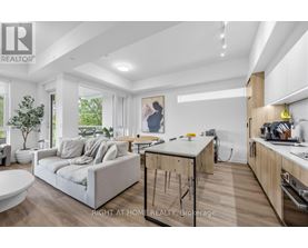 A modern kitchen with wooden cabinets and a breakfast bar.