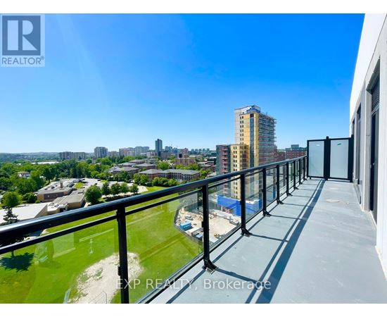 A balcony overlooks a cityscape with buildings and greenery.