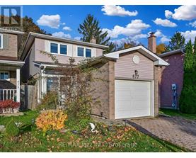A house with the number 677 on it is for sale.