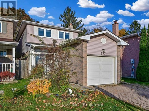A house with the number 677 on it is for sale.