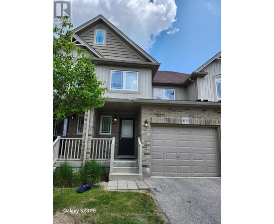 A two-story house with a garage and a driveway.