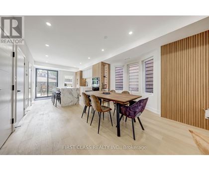 A dining room with a table and chairs is shown in the image.