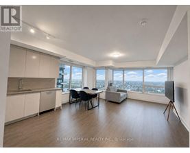 A spacious room with a dining table and chairs, a kitchen area, and a large window with a view of the city.