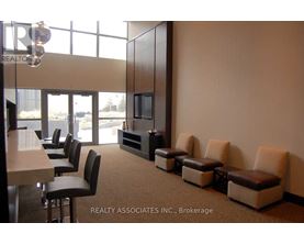 A conference room with a long table and chairs.