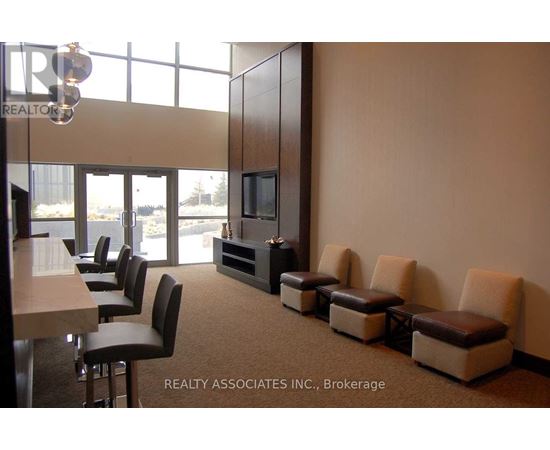 A conference room with a long table and chairs.