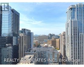 A cityscape with skyscrapers and a clear sky.