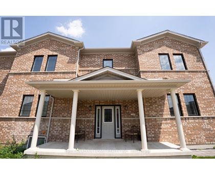 A brick house with a porch and a covered entrance.