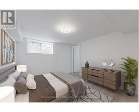 A bedroom with a bed, a dresser, and a potted plant.