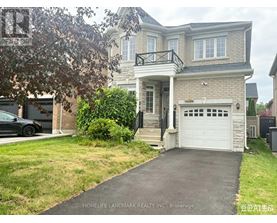A two-story house with a garage is for sale.