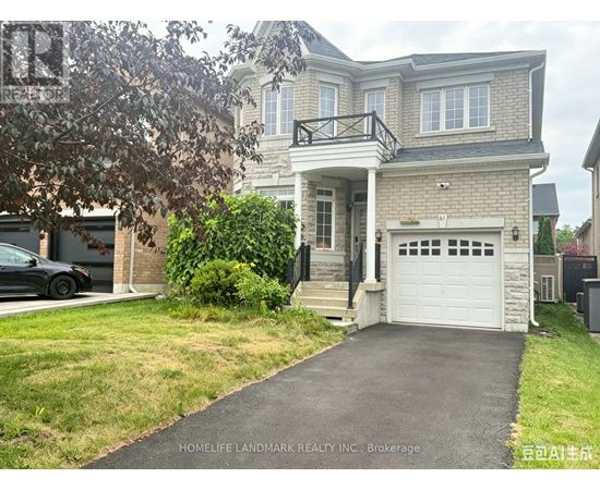 A two-story house with a garage is for sale.