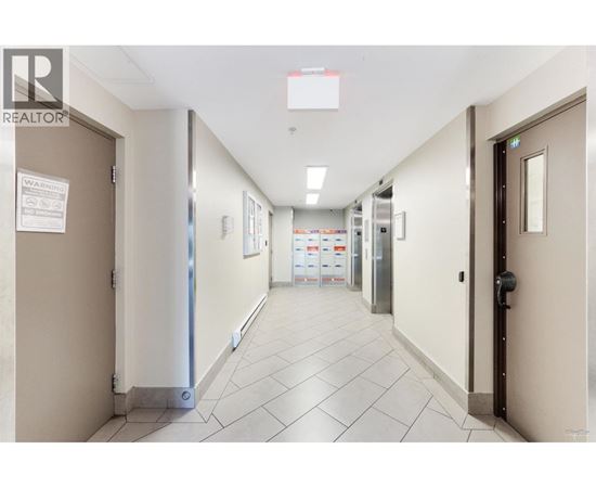 A hallway with a sign that says "REALTOR" on the top left corner.