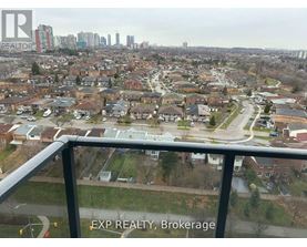 A view from a balcony of a residential area with the text "EXP REALTY, Brokerage" on the railing.