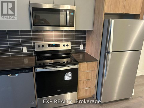 A kitchen with EXP REALTY Brokerage written on the wall.
