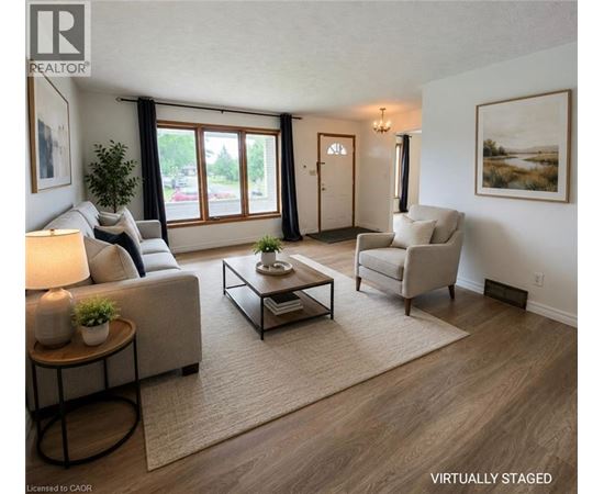 A living room with a couch, chair, and coffee table.