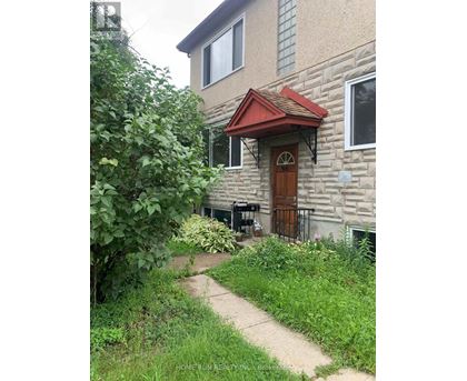 A house with a red awning and a brown door.