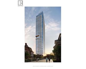 A tall, modern building with many windows is depicted in the image.