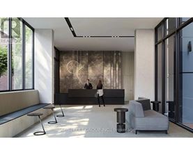 A brokerage office with a reception desk and two people standing behind it.