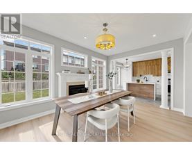 A modern kitchen with a dining table and chairs.