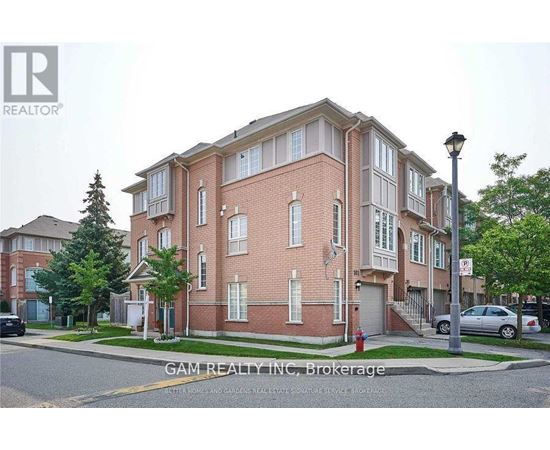 A brick building with a sign that says "GAM REALTY INC. Brokerage" in front of it.
