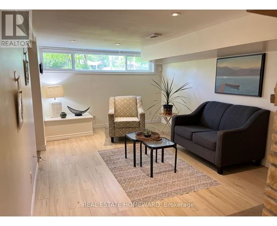 A living room with a couch, chair, and coffee table.
