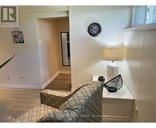 A living room with a couch and a lamp.
