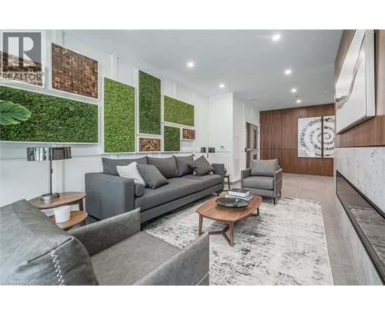 A living room with a grey couch and a coffee table.