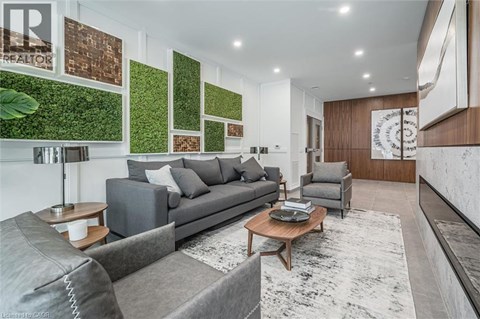 A living room with a grey couch and a coffee table.