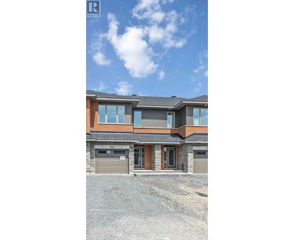 A two-story house with a garage is shown in the image.