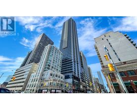 A cityscape with a tall building in the center and a street sign that reads "Brokerage.".