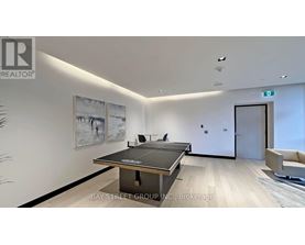 A modern office space with a black table and chairs.