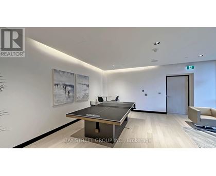 A modern office space with a black table and chairs.