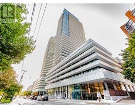 A modern multi-story building with a glass facade is the focal point of the image.