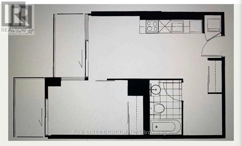 A floor plan of a property with a kitchen, living room, and bathroom.