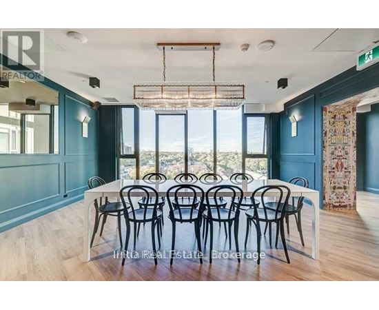 A dining room with a table set for six with a view of the outside.