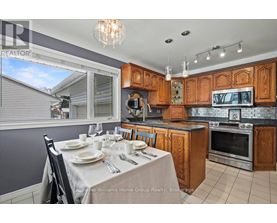 A kitchen with a table set for a meal.