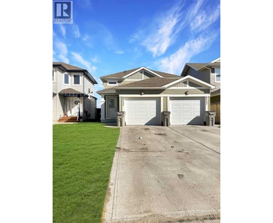 A realtor logo is displayed on a photo of a house.