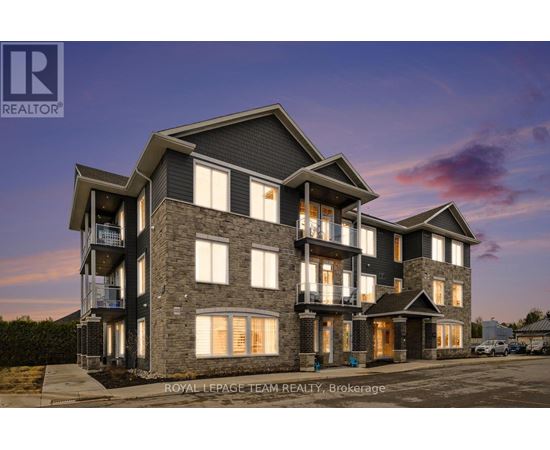 A modern multi-story residential building with balconies and large windows.