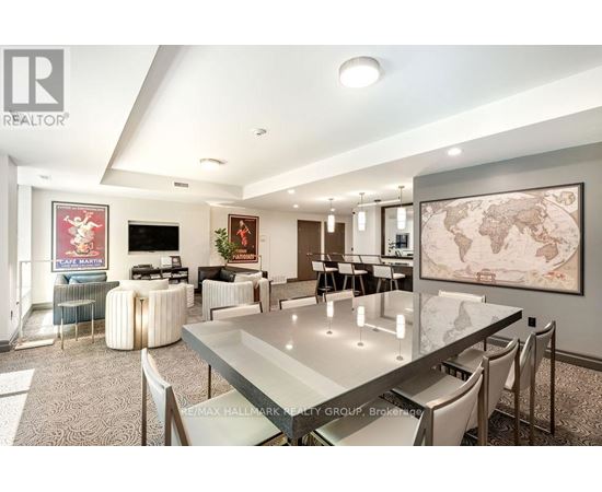 A modern dining room with a glass table and chairs.