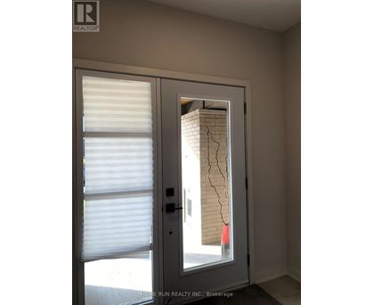 A door with a cracked wall behind it.
